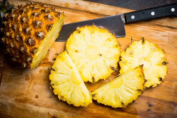 istock Fresh ripe pineapples on the rustic background 910061980