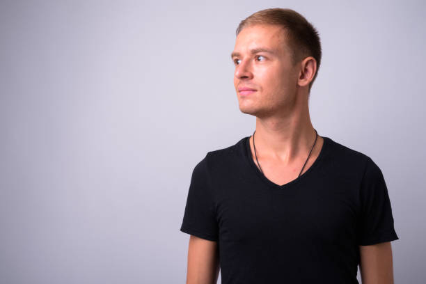 istock Portrait Of Young Man Against White Background 910062110