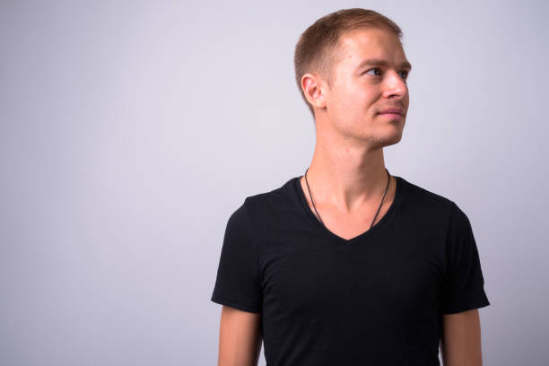istock Portrait Of Young Man Against White Background 910062156