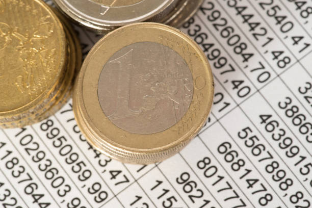 istock Spreadsheet and Euro Money Coins 910062250