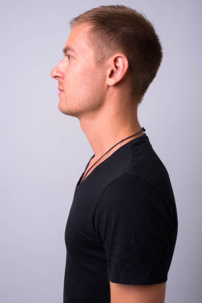 istock Portrait Of Young Man Against White Background 910062314