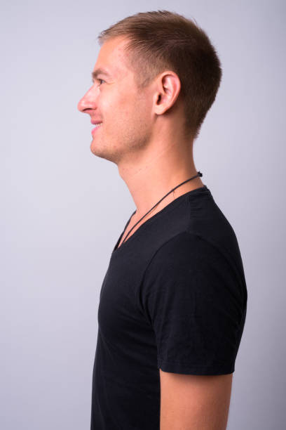 istock Portrait Of Young Man Against White Background 910062318