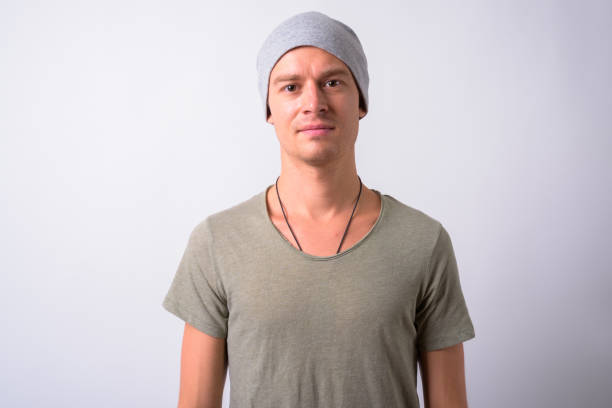 istock Portrait Of Young Man Against White Background 910062414