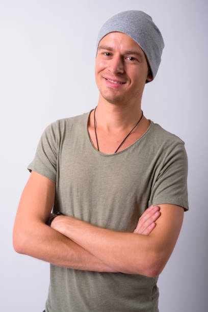 istock Portrait Of Young Man Against White Background 910062458