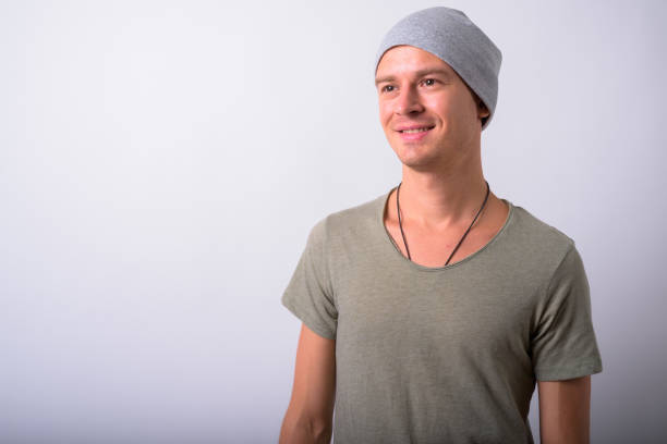 istock Portrait Of Young Man Against White Background 910062484