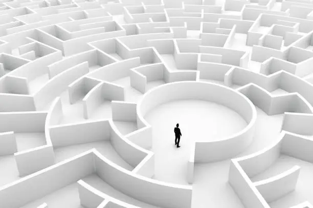 Photo of Businessman in the middle of the maze. Challenge concepts