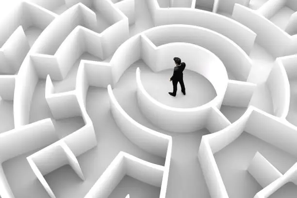 Photo of Businessman in the middle of the maze. Challenge concepts