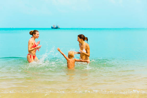 istock womans and baby on a tropical beach 910065676