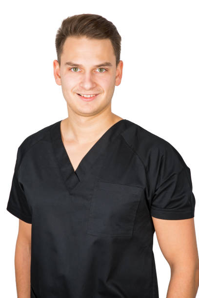 istock Young male dentist in black uniform 910066598