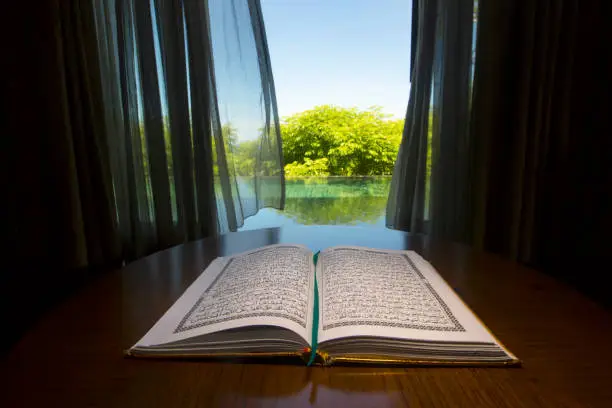 Open holy Koran book in the room