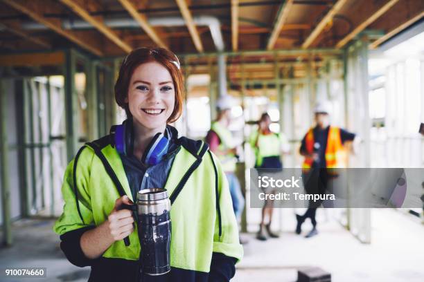 Construction Workers In Australian In Building Site Working And Doing Tasks Stock Photo - Download Image Now