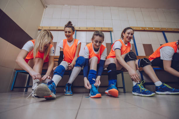 istock Volleyball team in locker room 910076346