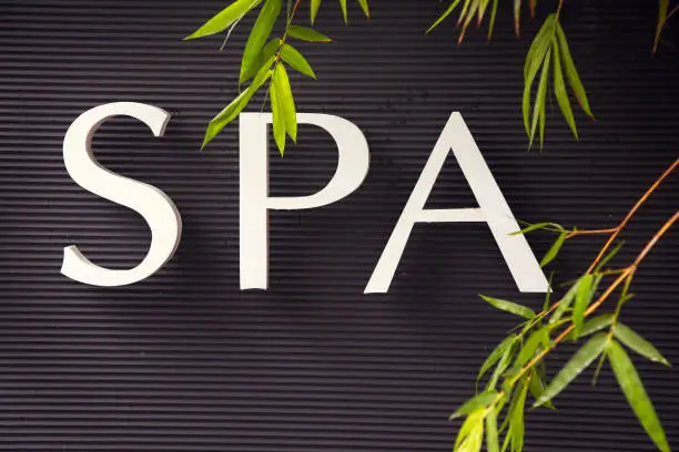 Photo of Spa sign on the black wall