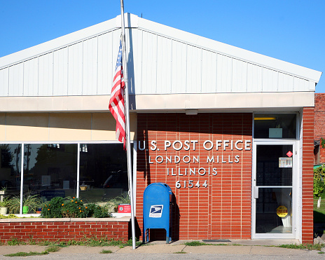 London Mills, Illinois-August 26, 2010:  Local small town post office in the midwest.  Small post offices like these are increasingly in danger of being closed due to budget constraints.