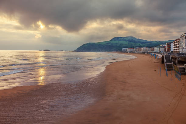 Sunrise on the beach of Zarautz, Basque Country, way of the St. James, Spain stock photo