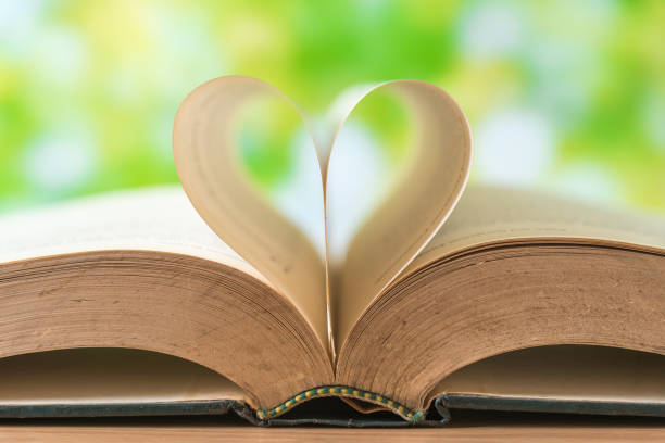 istock Close-Up Of Heart Shape Formed By Book Pages 910112132