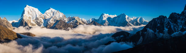 istock Snowy mountain peaks high above the clouds panorama Himalayas Nepal 910119426