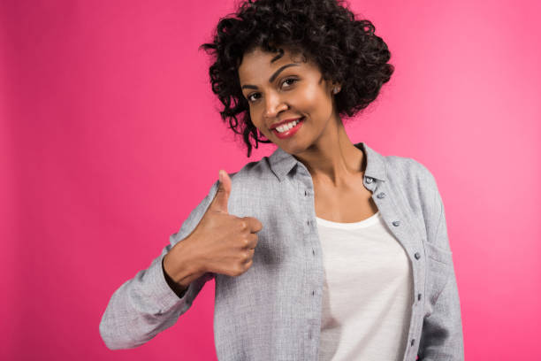 istock woman showing thumb up 910121192
