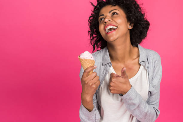 istock girl showing thumb up to ice cream 910124014