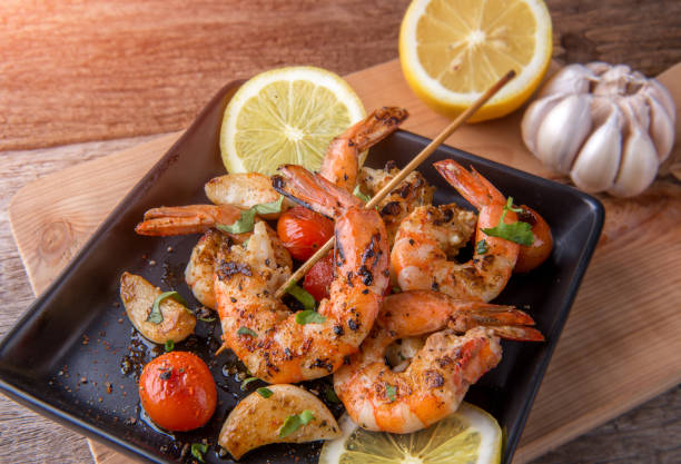 istock Skewers Barbeque grilled prawns with spicy ingredients. 910128658