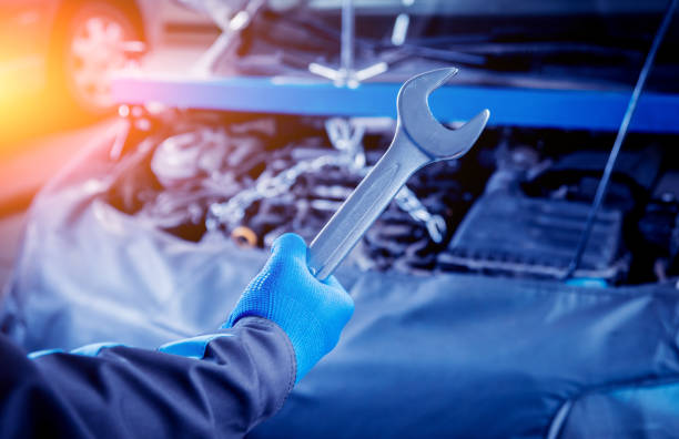 istock Repairing engine at service station. Car repair. 910132024
