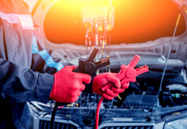 istock Accumulator charging. Hands and terminals. Car repair. 910132358