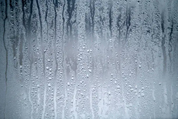 Photo of Steamy window and water drops