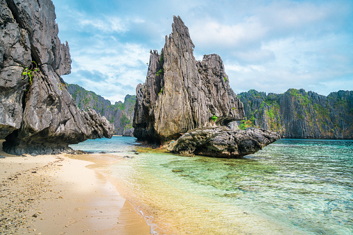 Many boats standing in turquoise water lagoon in Phi Phi Leh island bay in Thailand