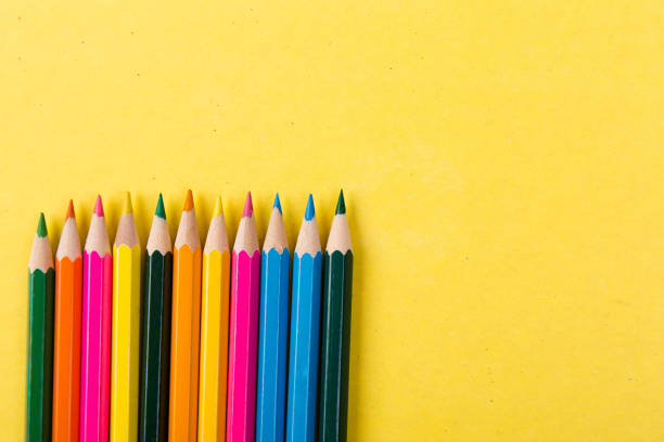 istock Colorful pencils on yellow background. 910139276