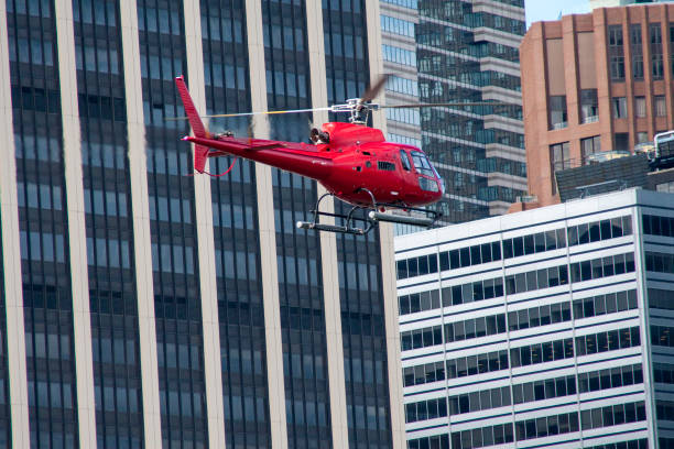 istock helicopter flying over urban city 910142280