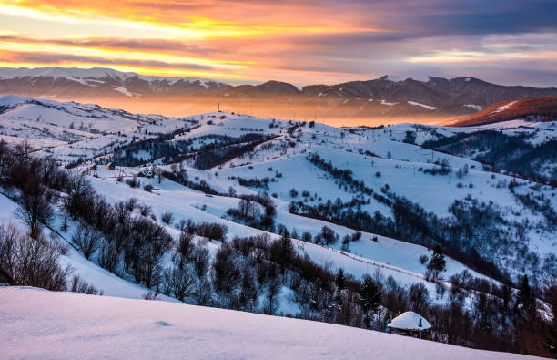 istock snowy mountainous countryside at sunrise 910144498
