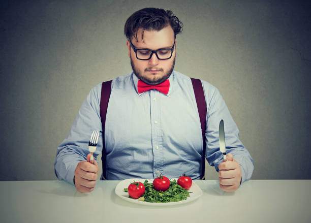 istock Chunky man trying to follow his diet 910145236