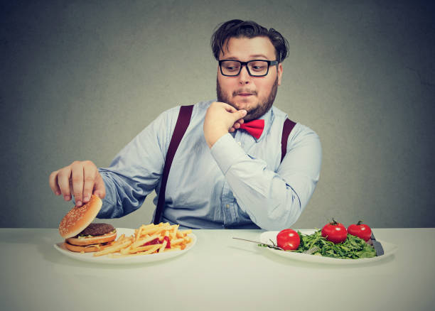 istock Chunky man craving delicious burger 910145320