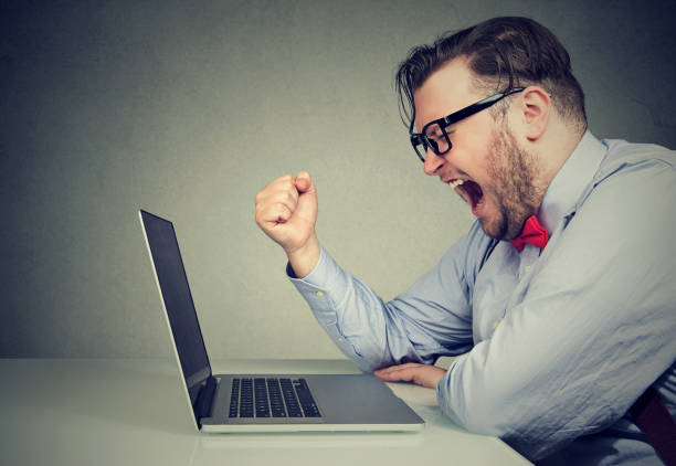 istock Angry man shouting at laptop 910145416