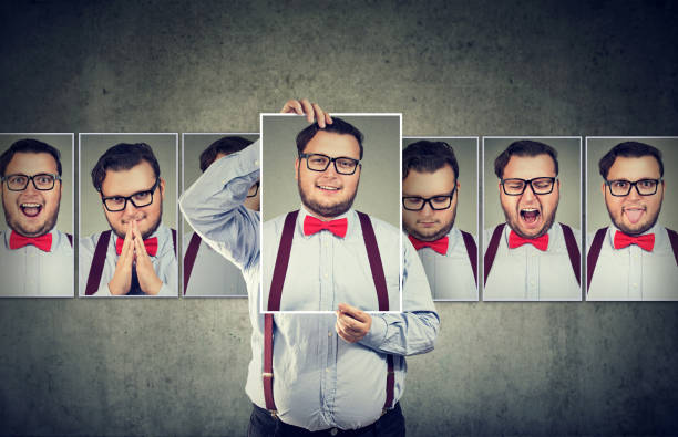 istock Man having mood swings posing at camera 910147684