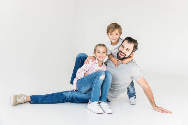 istock happy father with kids 910147692
