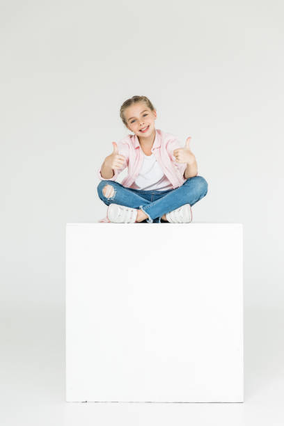 istock child showing thumbs up 910147758