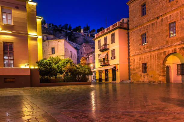 Syntagma square, the historical square of Nafplio surrouned by old beautiful   neoclassical buildings around the famous  square. stock photo