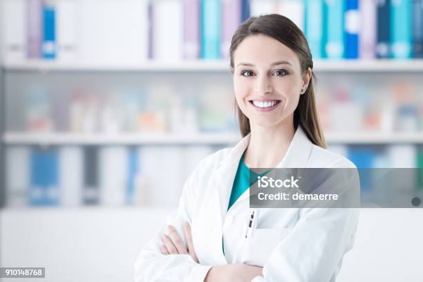 Confident Female Doctor Stock Photo - Download Image Now - Pharmacist, Pharmacy, Female Doctor