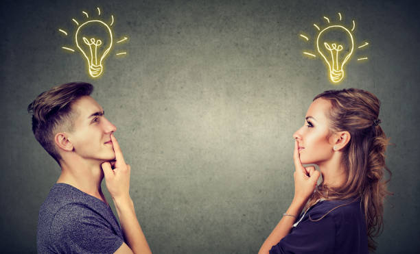 Content couple having great idea Young people man and woman posing together enlightened with idea looking positive. two people thinking stock pictures, royalty-free photos & images