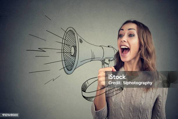 Cheerful Woman Sharing With News Using Loudspeaker Stock Photo - Download Image Now - Communication, Megaphone, Marketing