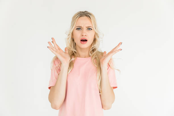 istock woman looking at camera isolated on white 910151194