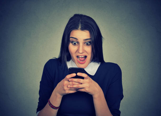 istock Shocked woman watching cellphone 910151490