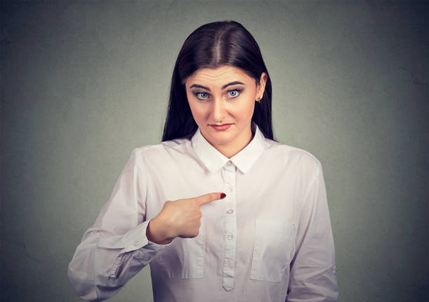istock Surprised woman pointing at herself 910151658