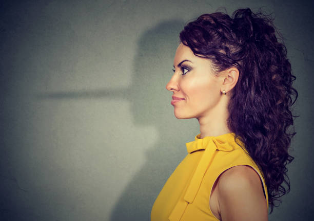 istock Pretending woman hiding lie 910151794