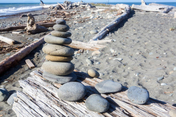 istock Stacked stones on Driftwood on a sunny day 910152060