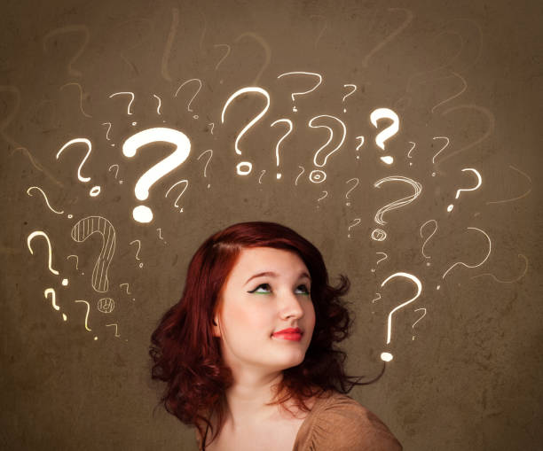 istock girl with question mark symbols around her head 910155832