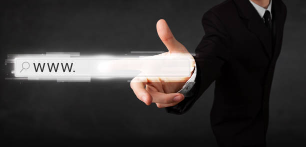 istock Young businessman touching web browser address bar with www sign 910156438
