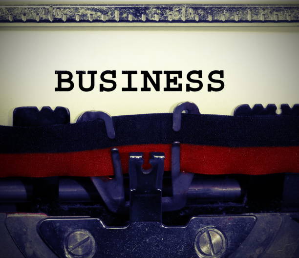 istock White page and Text BUSINESS written with the old typewriter 910156482