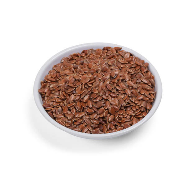 istock Pile of raw flax seeds isolated on white background 910158862